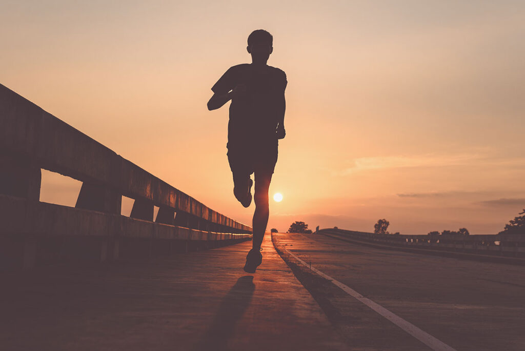 man jogging along street